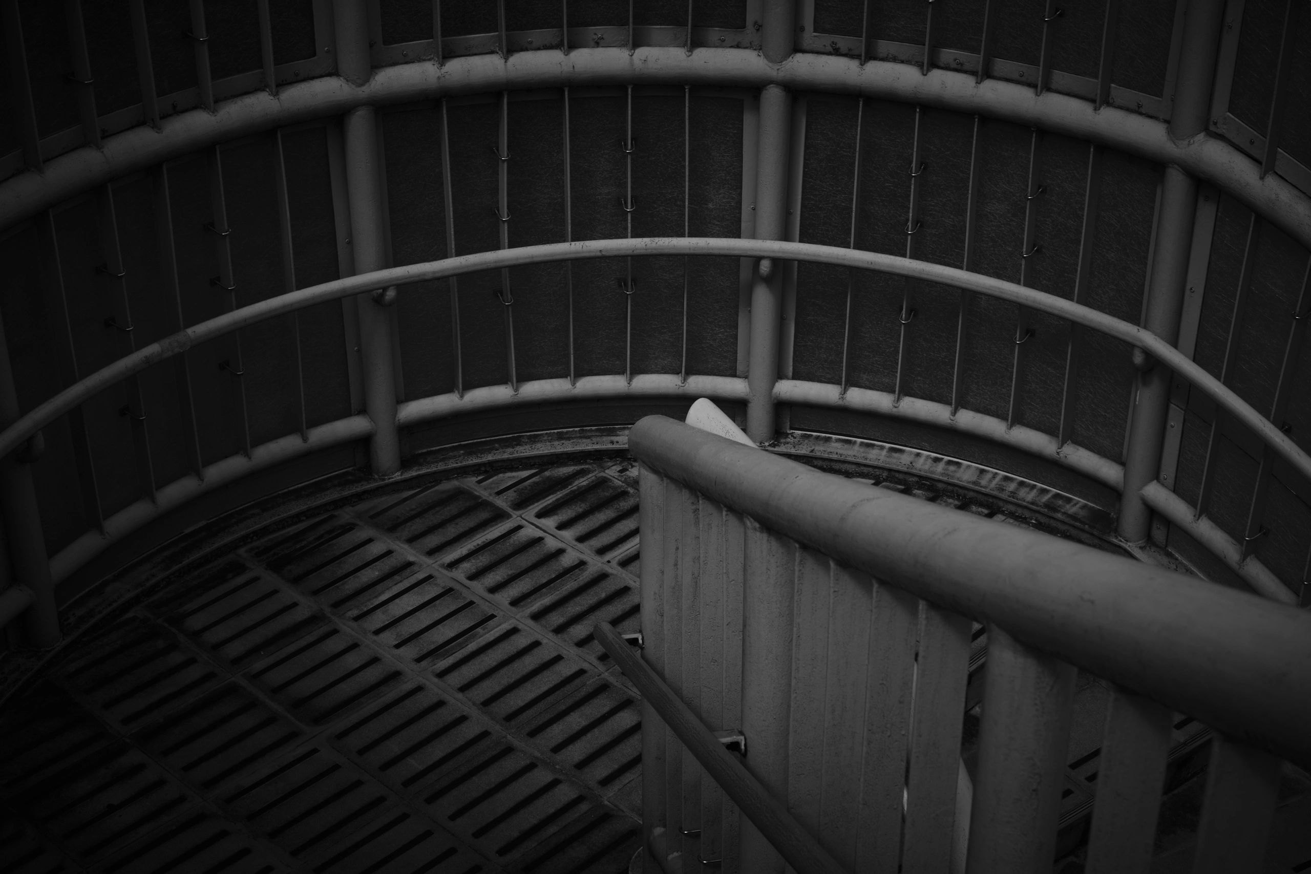 Black-and-white industrial elevator shaft and stairwell