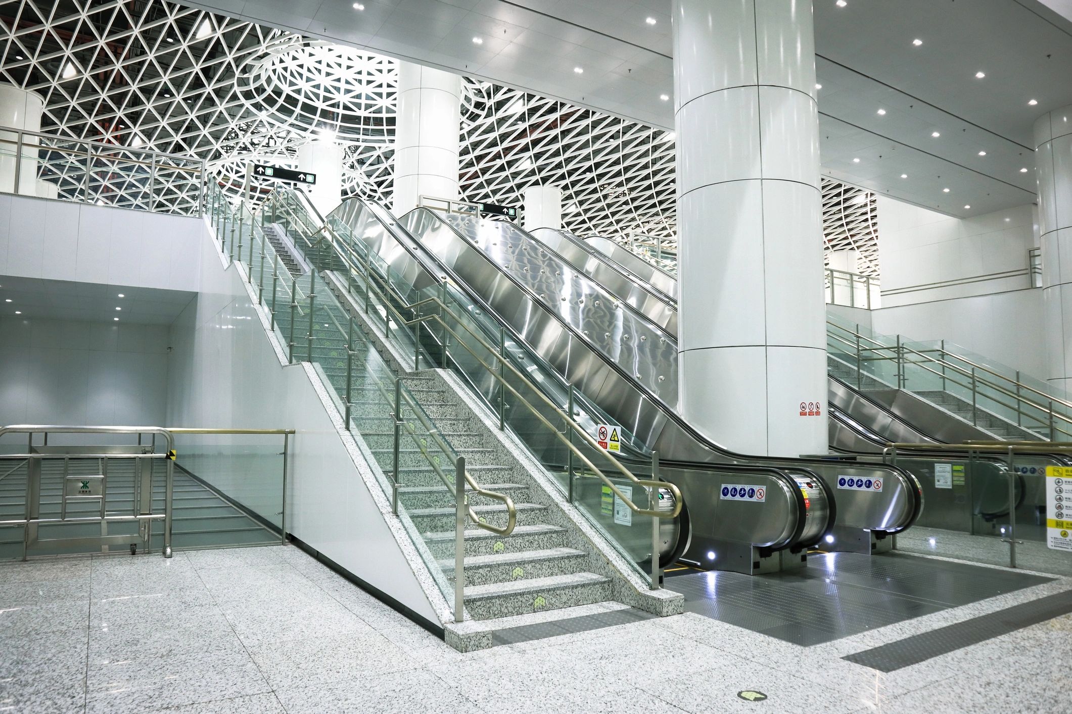 Black-and-white escalator in modern industrial transit station