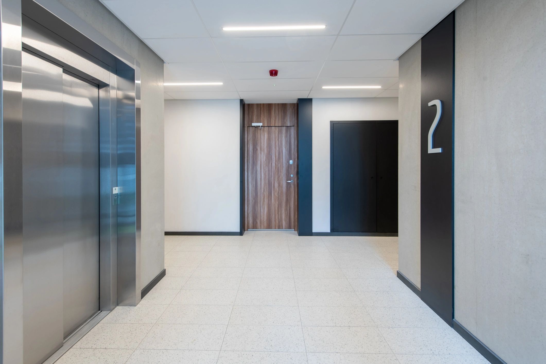 Black-and-white industrial modern elevator and stairwell