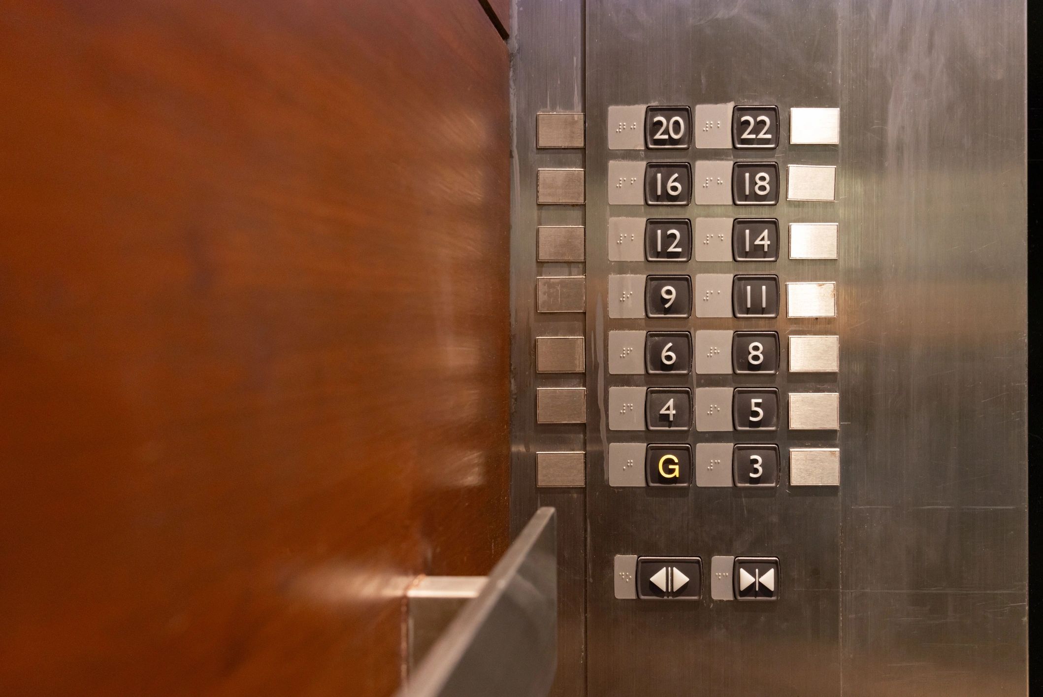 Black-and-white elevator button panel detail